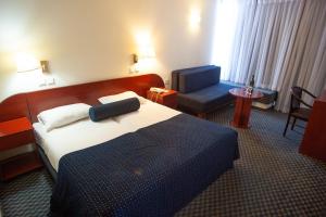 Postel nebo postele na pokoji v ubytování King Solomon Hotel Tiberias