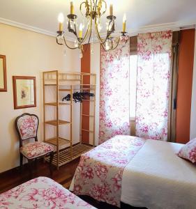 Postel nebo postele na pokoji v ubytování La Casa de Begoña