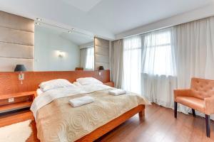 
Łóżko lub łóżka w pokoju w obiekcie Milano Premium - Neptun Park

