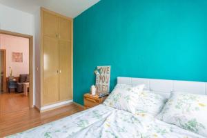 Łóżko lub łóżka w pokoju w obiekcie Apartamento Urgel