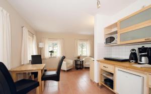 a kitchen with a table and a dining room at Fährmannhaus in Bad Schandau