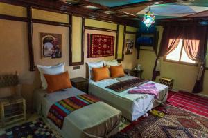 Voodi või voodid majutusasutuse Riad Atlas Panorama toas