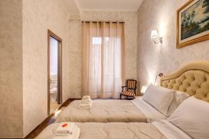 a bedroom with a large bed and a window at AMICI GUESTHOUSE in Rome