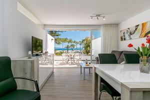 a living room with a view of the ocean at Apartment CB 2 in Alcudia