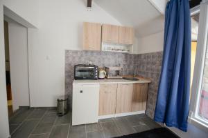Kuchyň nebo kuchyňský kout v ubytování Apartment Citta Vecchia