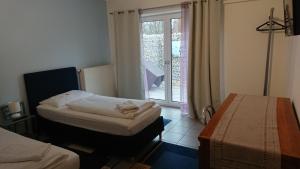 Postel nebo postele na pokoji v ubytování Gästehaus Schmitt