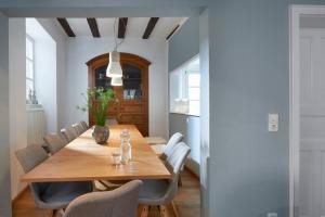 a dining room with a wooden table and chairs at Ferienhaus Apple Tree in Treis-Karden