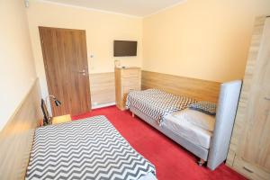 Posteľ alebo postele v izbe v ubytovaní Botanik Hostel