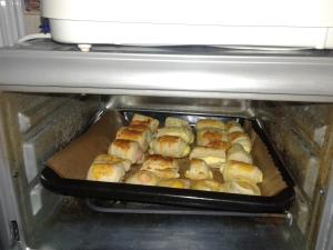 a tray of food sitting in an oven at Casa 4 Anotimpuri in Gura Bîscei