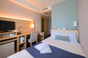 Postel nebo postele na pokoji v ubytování Shonandai Daiichi Hotel Fujisawa Yokohama
