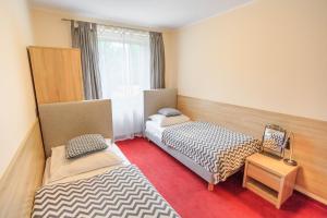 Posteľ alebo postele v izbe v ubytovaní Botanik Hostel
