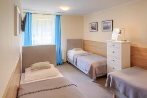 Posteľ alebo postele v izbe v ubytovaní Botanik Hostel
