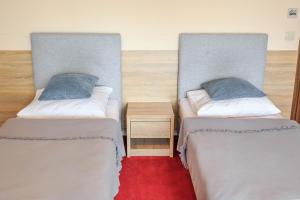 Posteľ alebo postele v izbe v ubytovaní Botanik Hostel