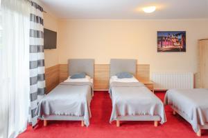 Posteľ alebo postele v izbe v ubytovaní Botanik Hostel