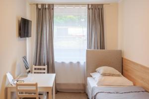 Posteľ alebo postele v izbe v ubytovaní Botanik Hostel