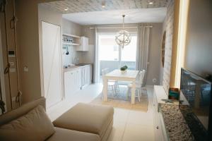a living room with a couch and a table at Terradamare in Monopoli +37 photos