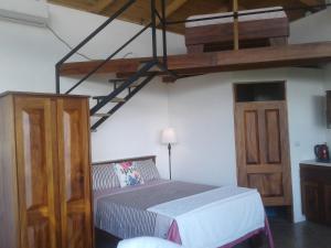 Ένα ή περισσότερα κρεβάτια σε δωμάτιο στο El nido rojo