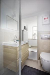a bathroom with a sink and a toilet at Ferienhaus Apple Tree in Treis-Karden +35 photos