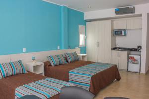 Ένα ή περισσότερα κρεβάτια σε δωμάτιο στο COMPLEJO ALOHA