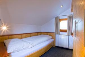 Postel nebo postele na pokoji v ubytování Hotel Lukas