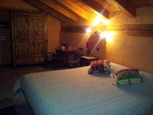 Un pat sau paturi într-o cameră la Il Rifugio della Volpe