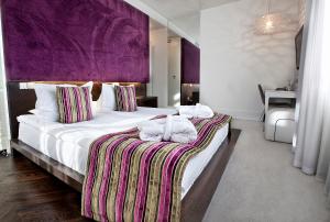 Posteľ alebo postele v izbe v ubytovaní Platinum Residence Boutique