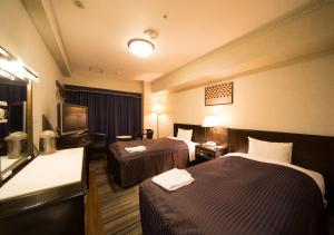 Postel nebo postele na pokoji v ubytování Hotel Claiton Esaka + 31 fotografií