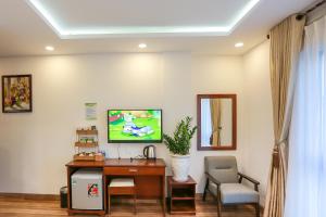 TV a/nebo společenská místnost v ubytování HODI Hotel