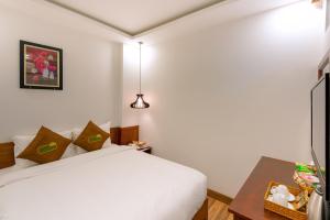 Postel nebo postele na pokoji v ubytování HODI Hotel