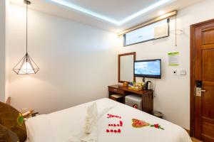 Postel nebo postele na pokoji v ubytování HODI Hotel