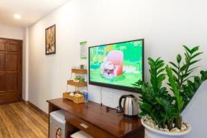 TV a/nebo společenská místnost v ubytování HODI Hotel