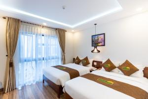 Postel nebo postele na pokoji v ubytování HODI Hotel