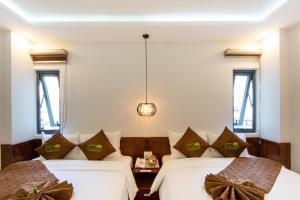 Postel nebo postele na pokoji v ubytování HODI Hotel