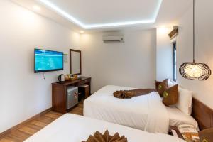 Postel nebo postele na pokoji v ubytování HODI Hotel
