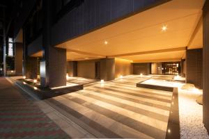 an empty lobby of a building at night at Hotel Keihan Kyoto Hachijoguchi in Kyoto