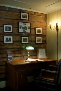 an office with a desk with a lamp on it at Seljord Hotel - Unike Hoteller in Seljord