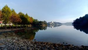 a view of a river with trees on the shore at Sun Moon Lake FRIDAY Inn Guest House in Yuchi +40 photos