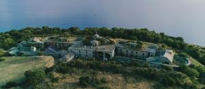 an aerial view of a house on an island in the water at Mon Perin Castrum - Rooms Dado in Bale