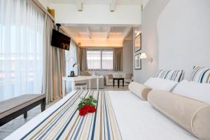 Televízia a/alebo spoločenská miestnosť v ubytovaní Hotel Oliveto