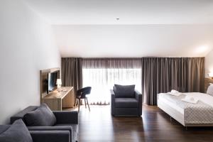 Postel nebo postele na pokoji v ubytování Hotel Antonio