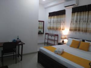 Postel nebo postele na pokoji v ubytování Kandy Citylights Residence