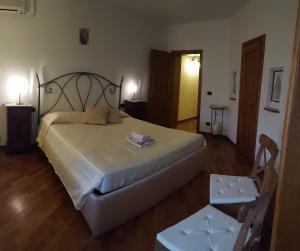 Letto o letti in una camera di Casa Leonardo