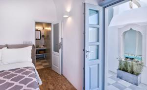 Postel nebo postele na pokoji v ubytování Namaste Suites by Oias Local Cavehouses