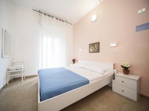 Posteľ alebo postele v izbe v ubytovaní Hotel Colombo