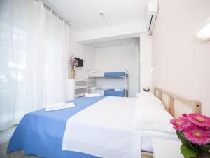 Posteľ alebo postele v izbe v ubytovaní Hotel Colombo