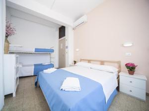 Posteľ alebo postele v izbe v ubytovaní Hotel Colombo