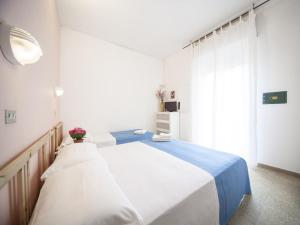 Posteľ alebo postele v izbe v ubytovaní Hotel Colombo