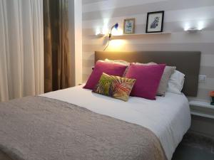 A bed or beds in a room at Residencial Colibrí