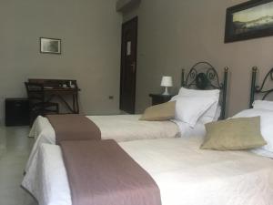 Posteľ alebo postele v izbe v ubytovaní Soggiorno Paradiso