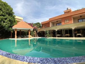 Imagem da galeria de HOTEL Le Clos Des Papillons em Saly Portudal